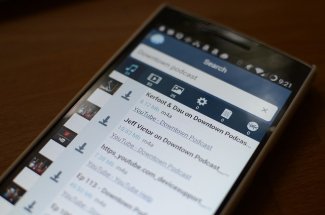 Image of FrostWire for Android searching for the Creative Commons licensed Downtown Podcast, results appear to come from YouTube. This is a screenshot of FrostWire Plus. If you click or touch this image you will be redirected to the FrostWire Plus download page at FrostWire.com where you can get the .apk file